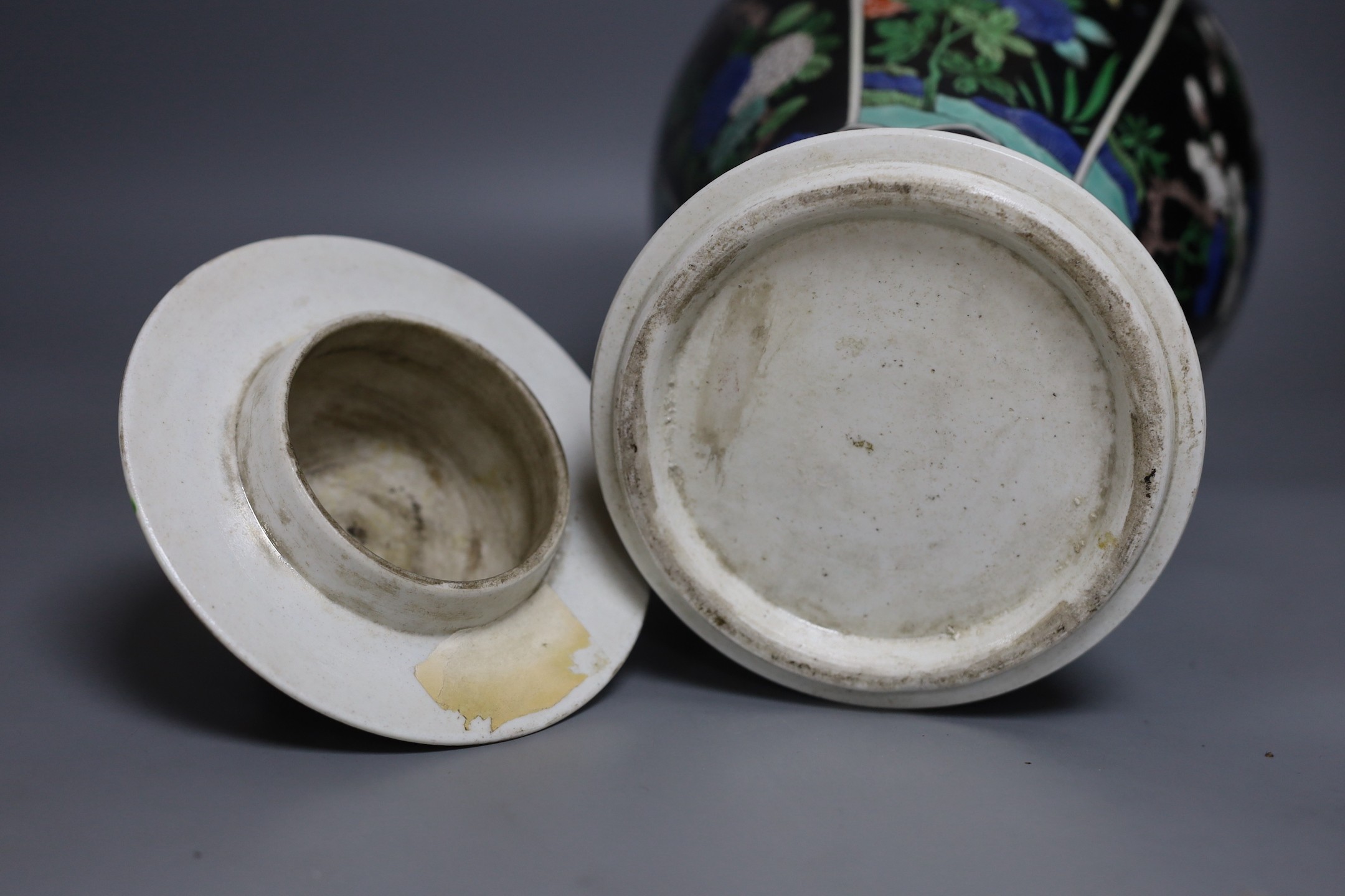 A late 19th century Chinese famille noire enamelled biscuit baluster vase and cover, 49cm high
